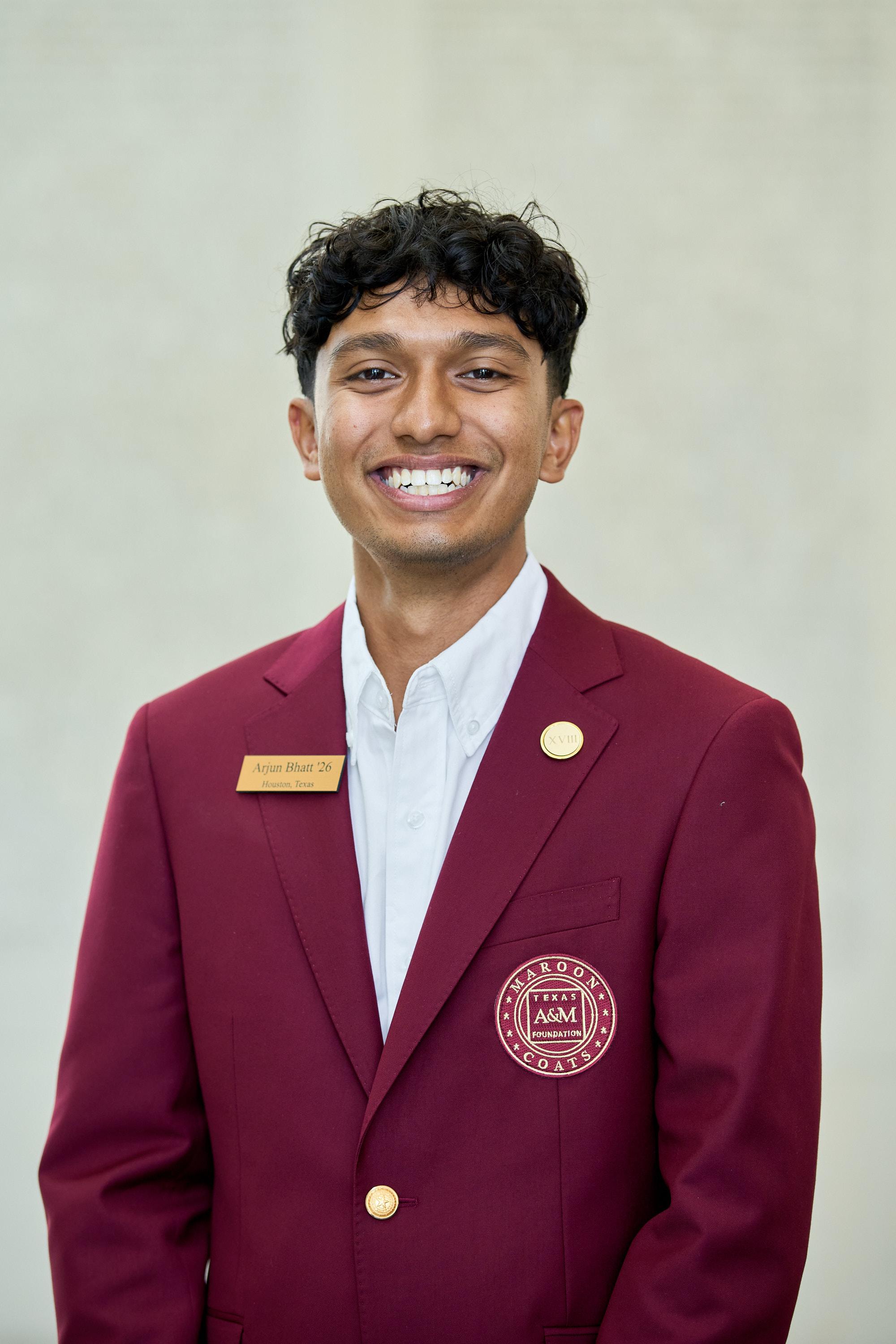 Maroon coat staff image