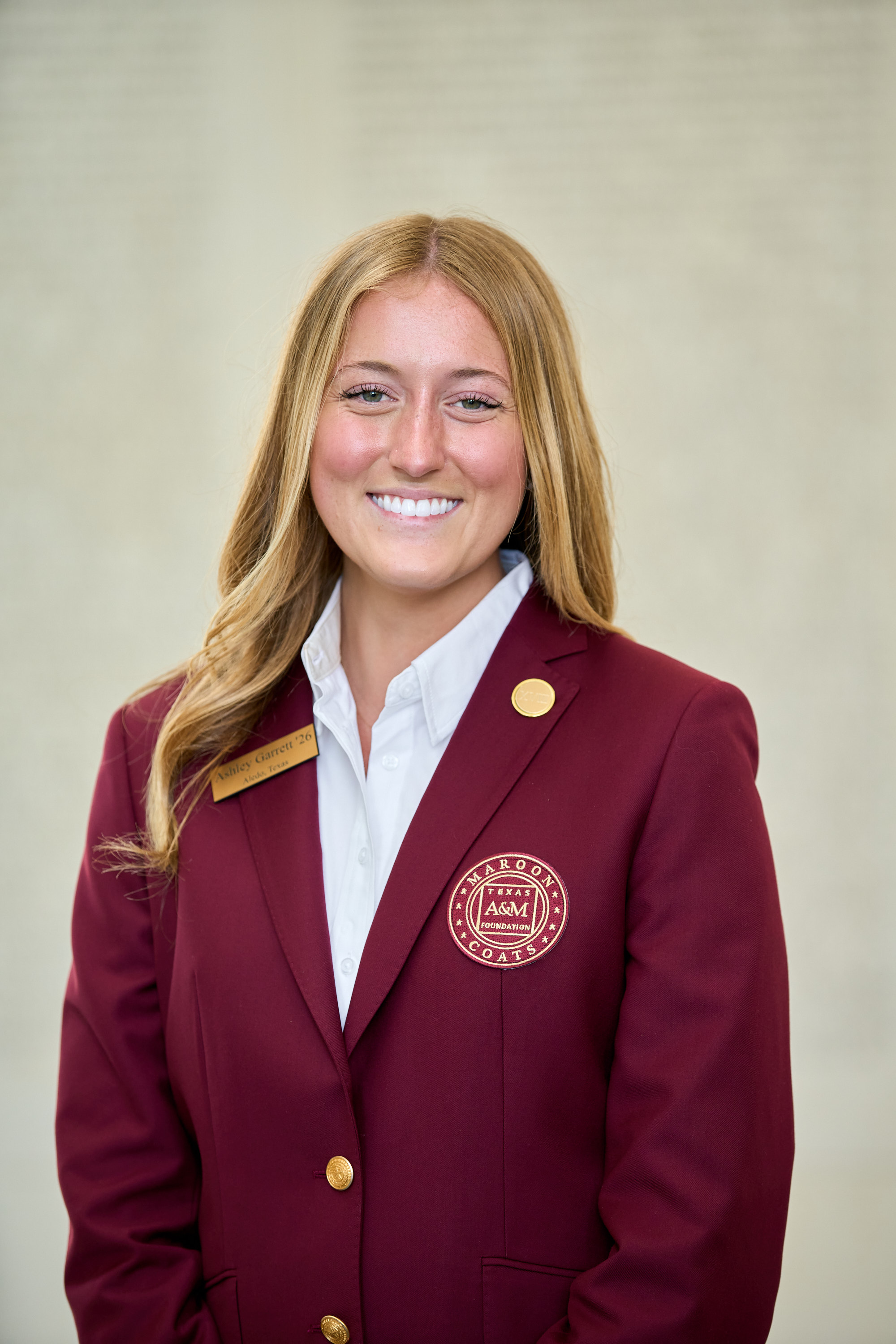 Maroon coat staff image