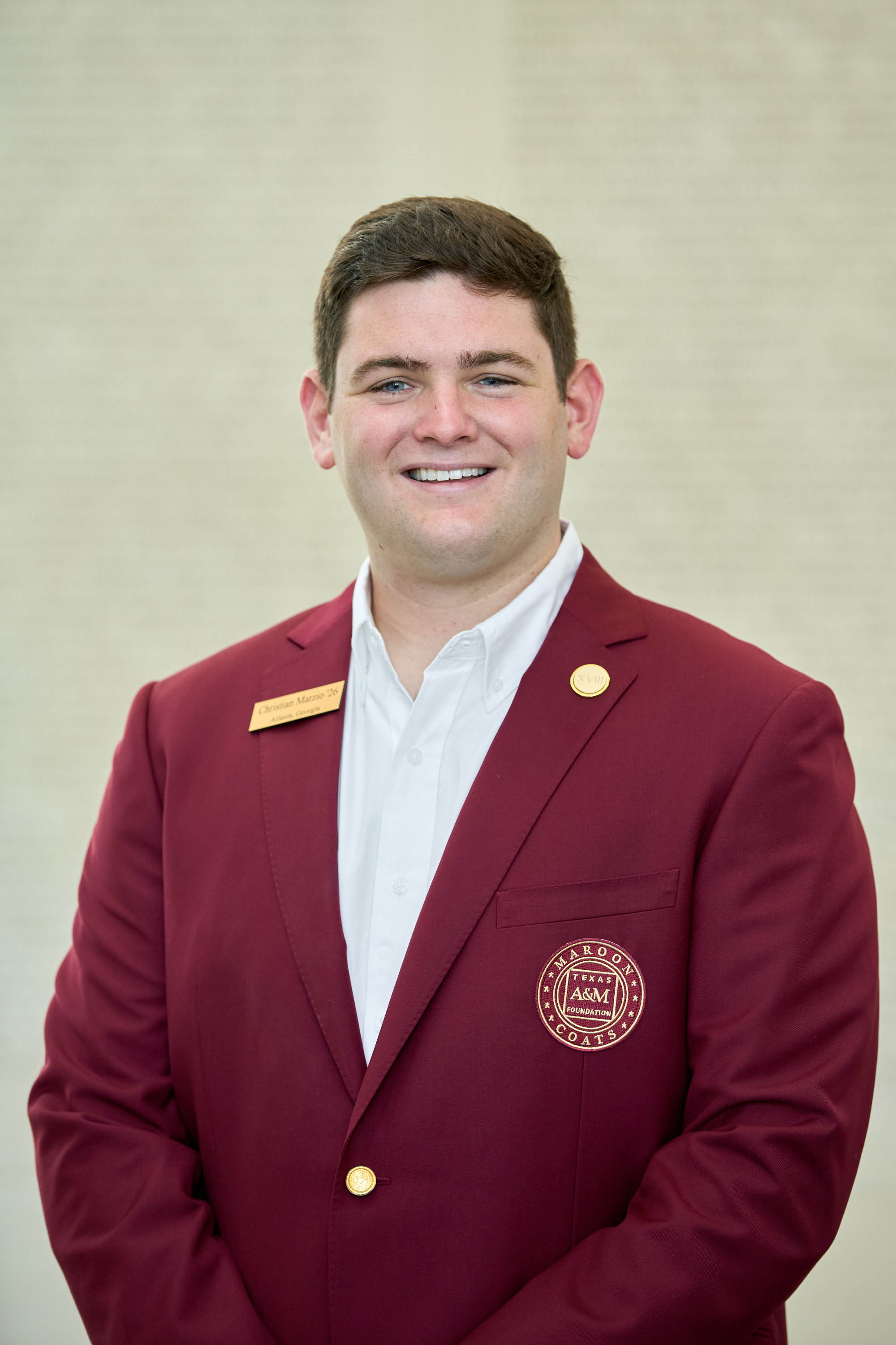 Maroon coat staff image