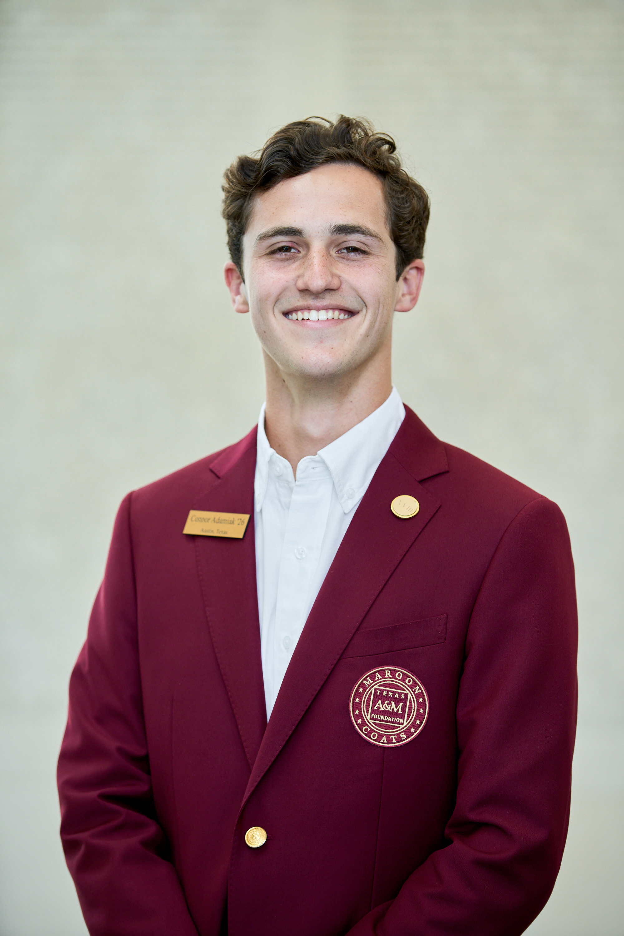 Maroon coat staff image