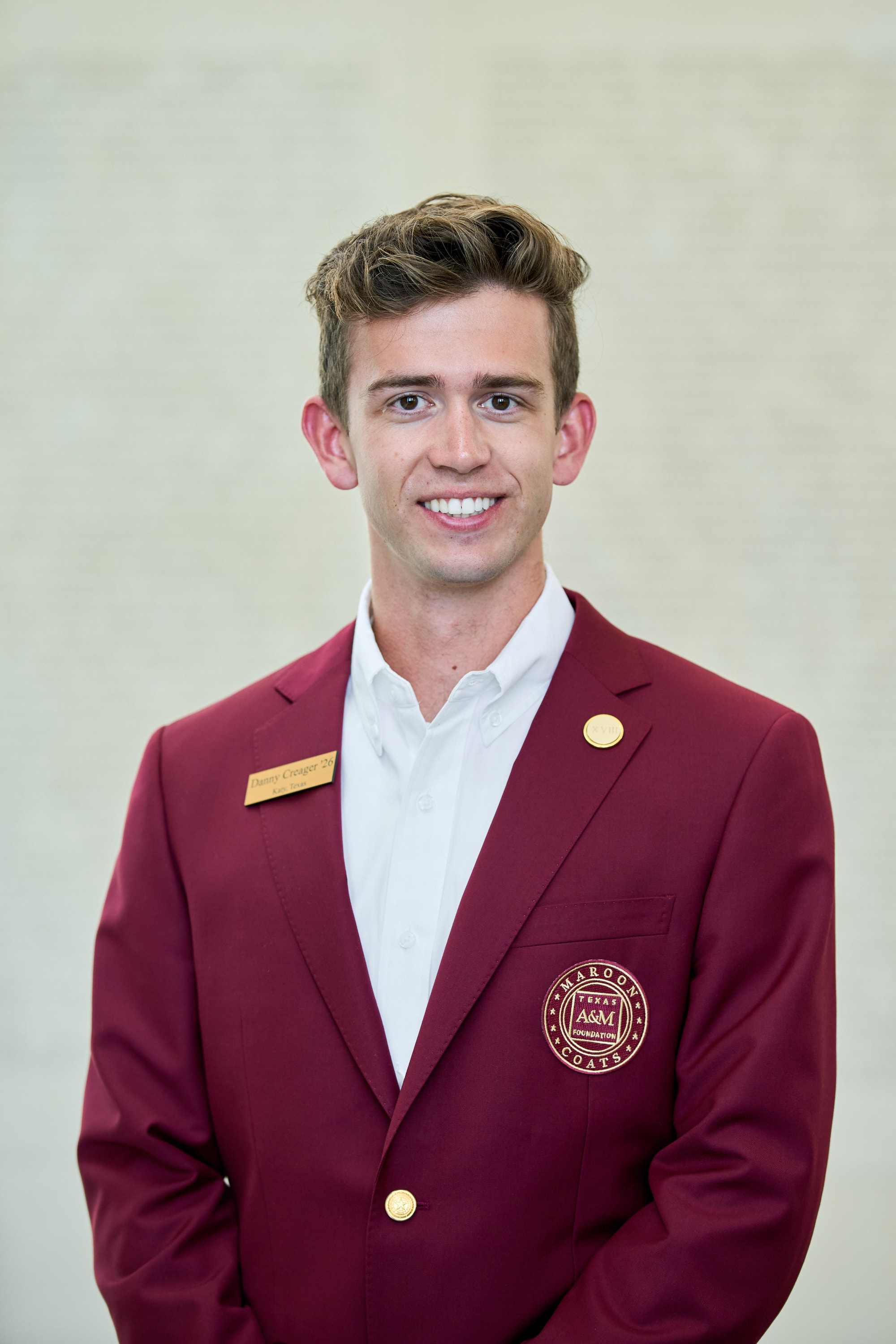 Maroon coat staff image