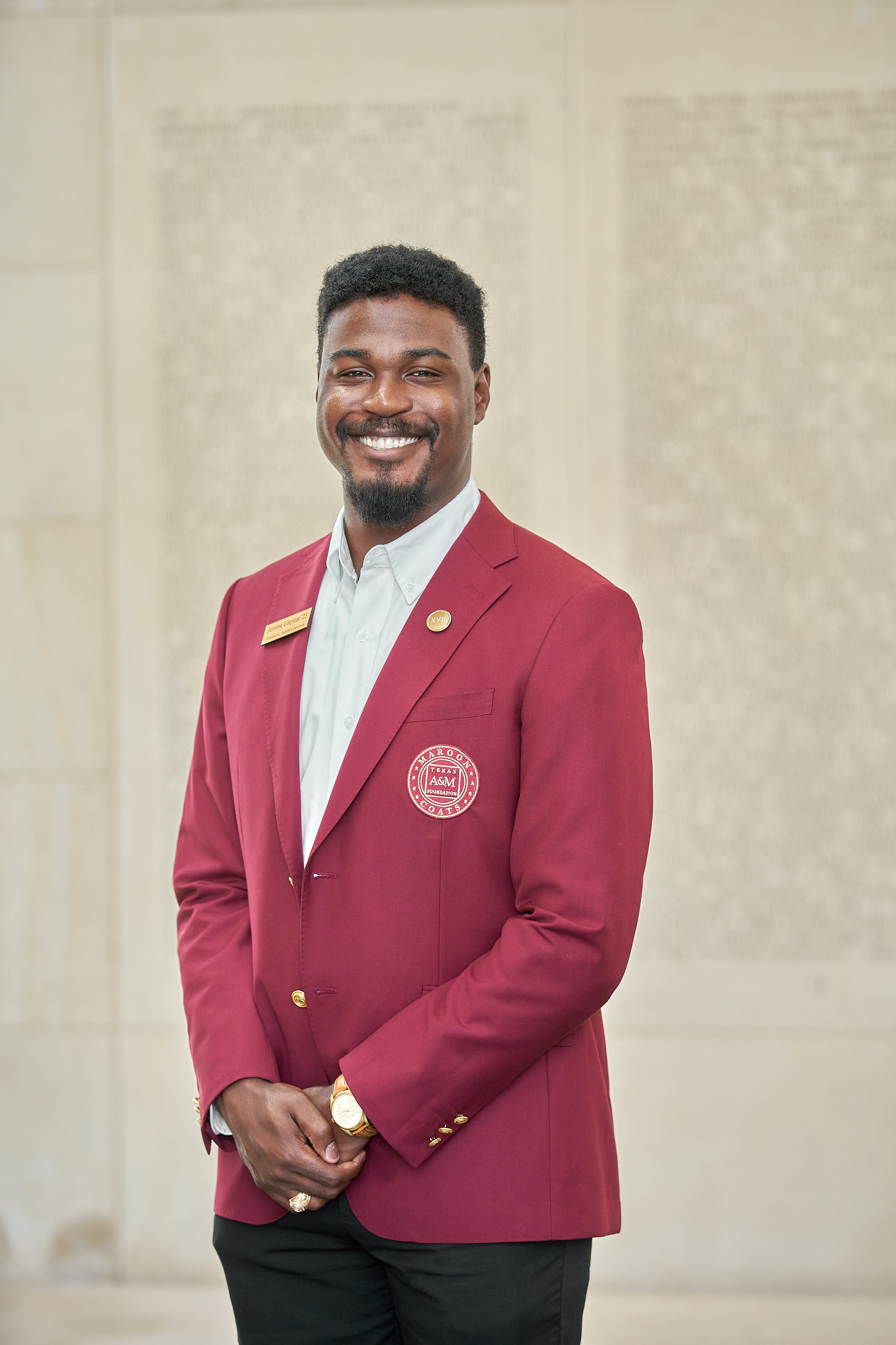 Maroon coat staff image