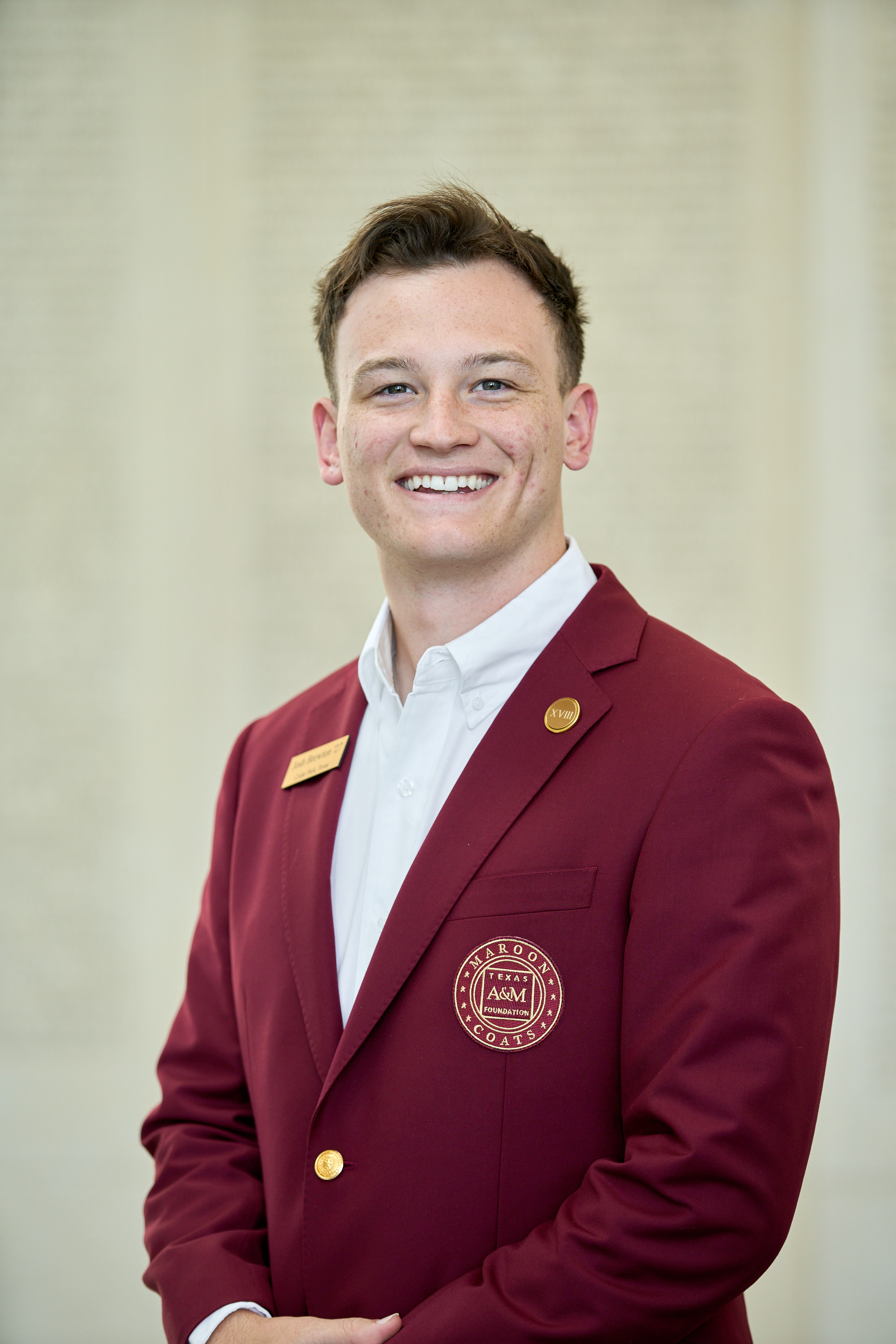 Maroon coat staff image