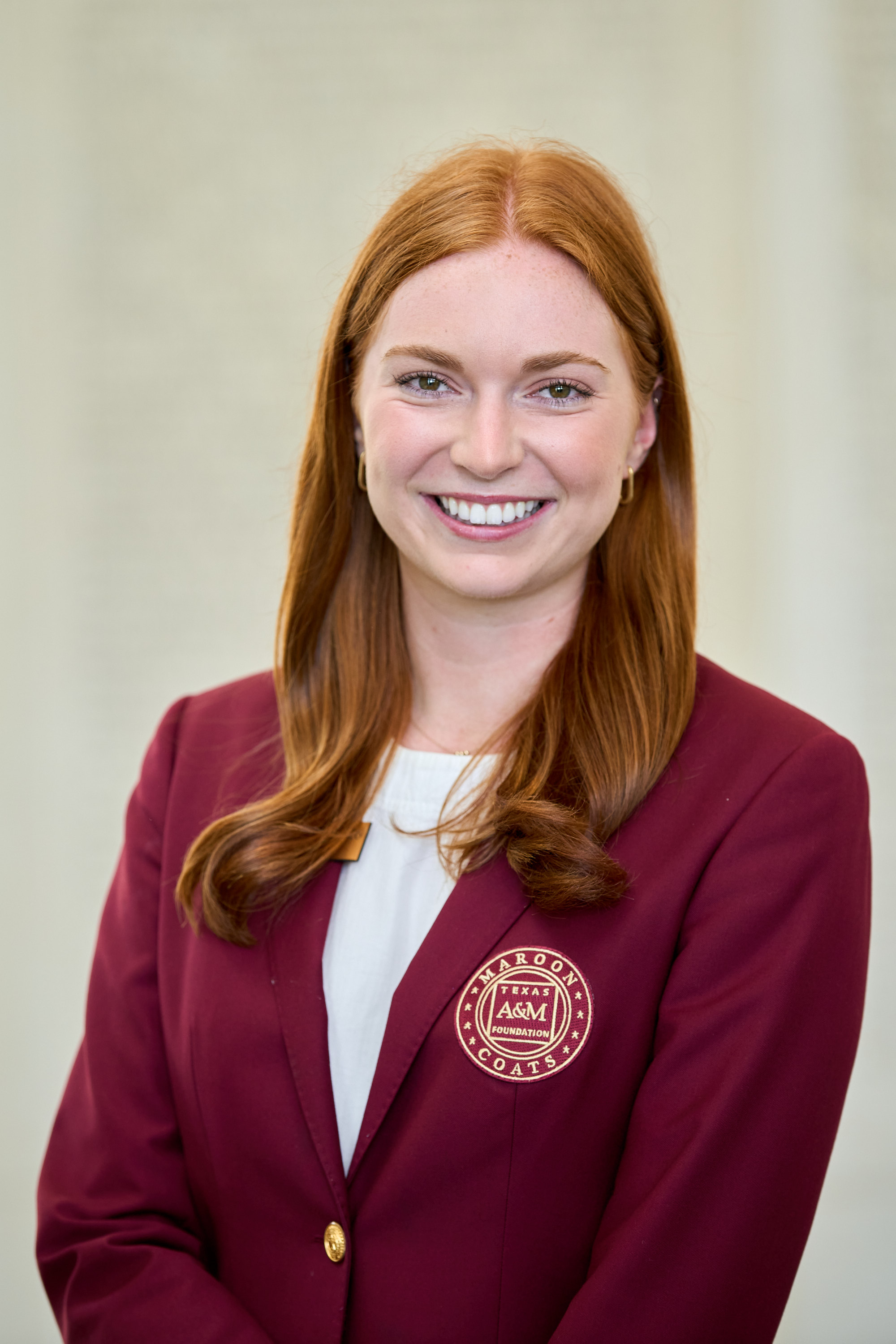 Maroon coat staff image