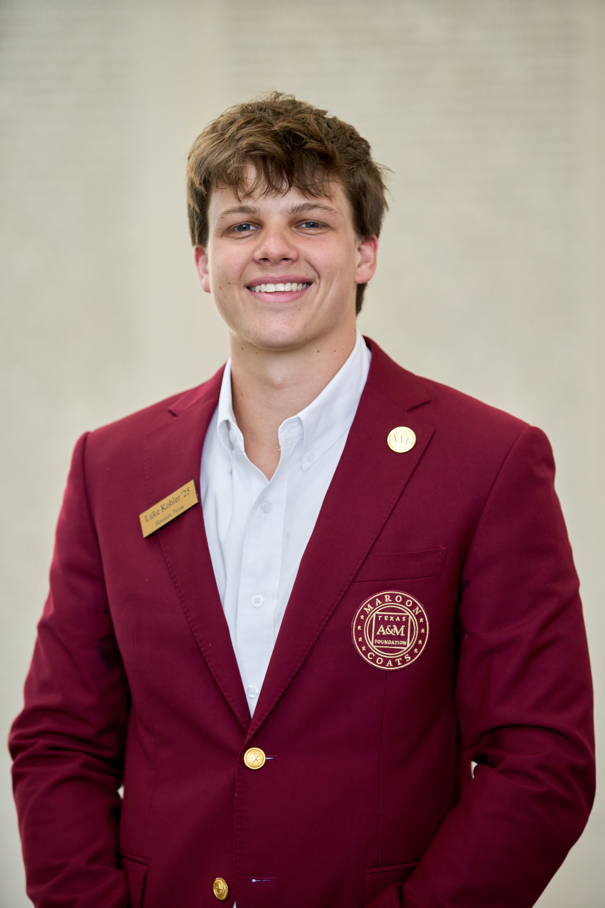 Maroon coat staff image