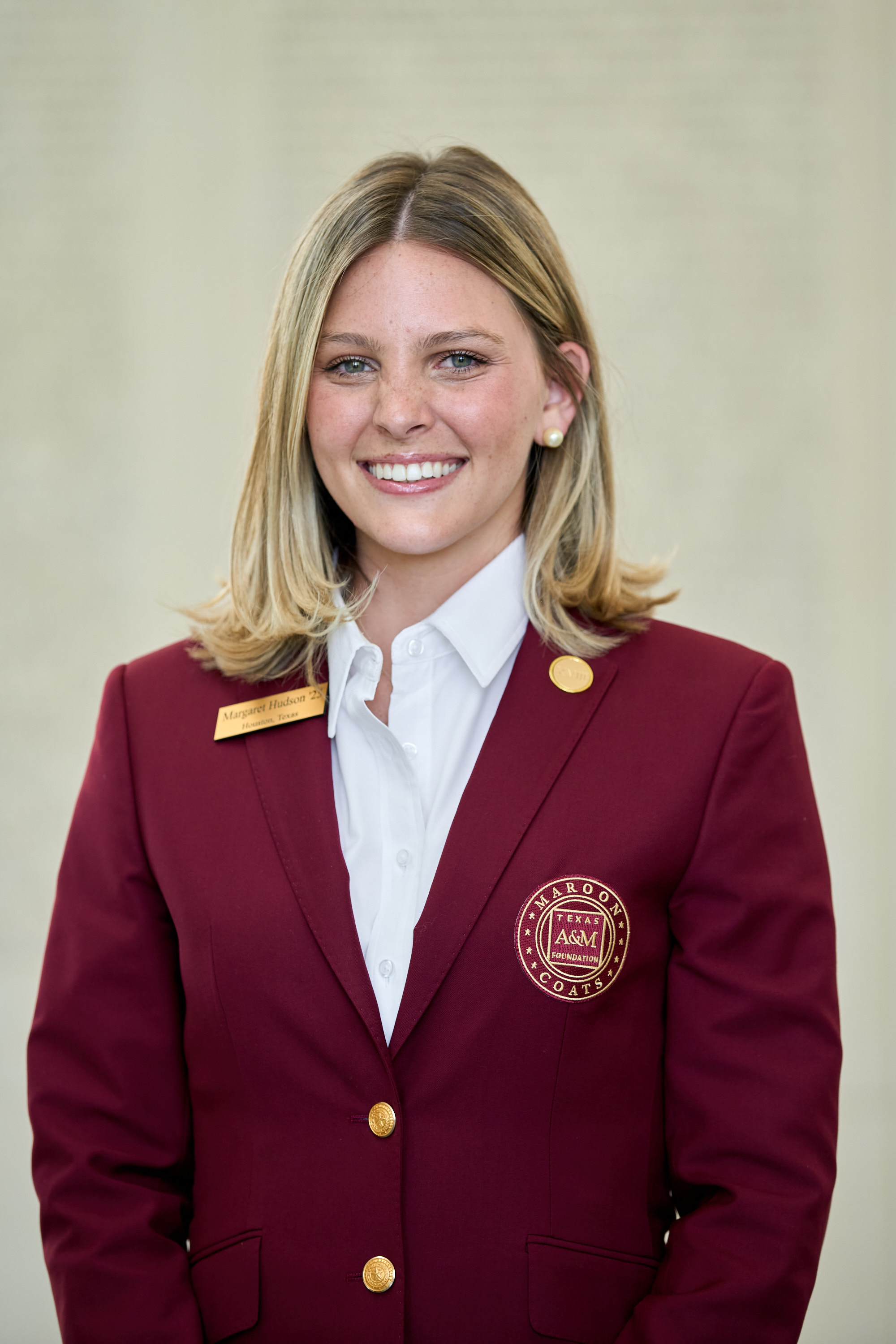 Maroon coat staff image