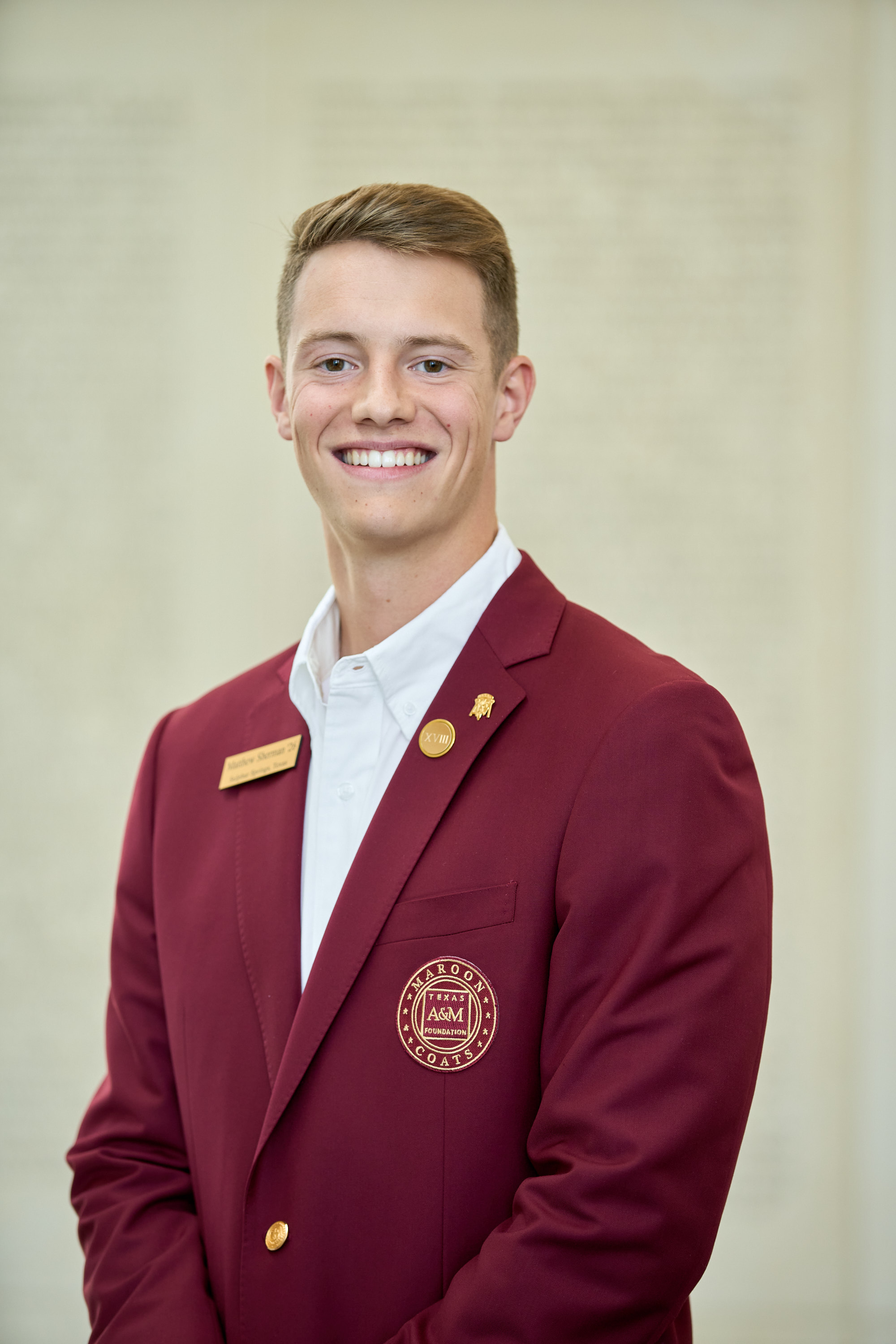 Maroon coat staff image