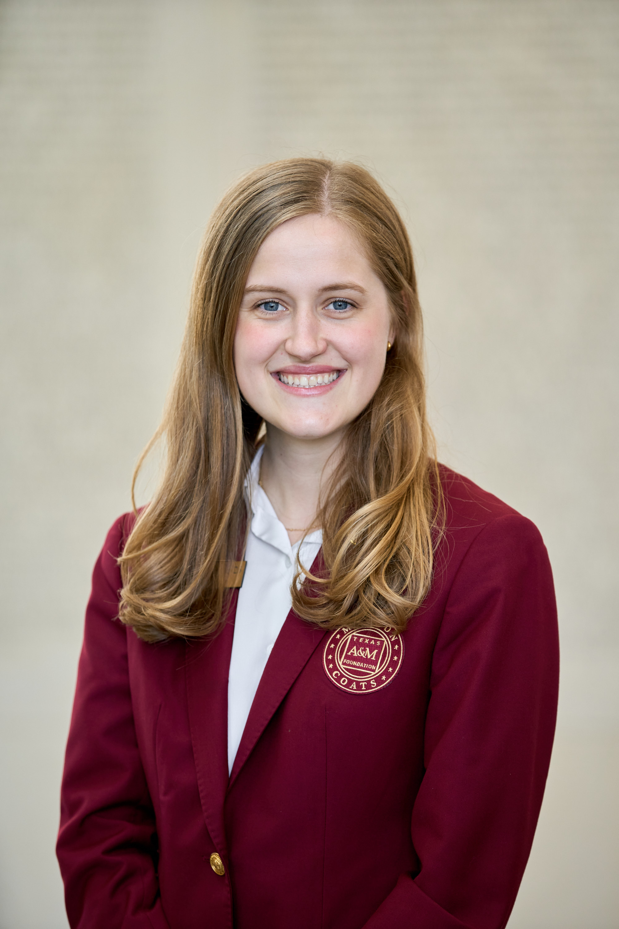 Maroon coat staff image