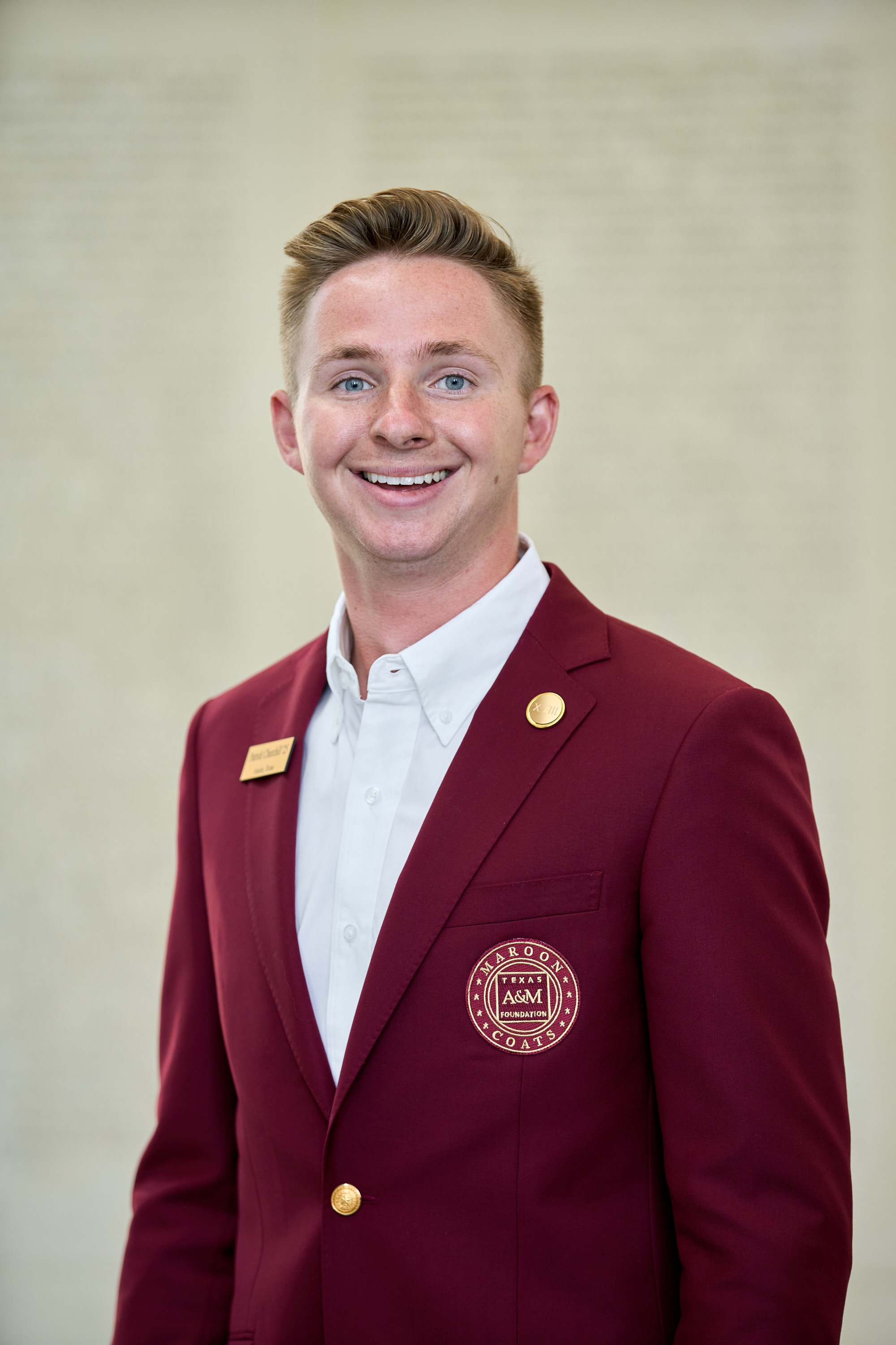 Maroon coat staff image