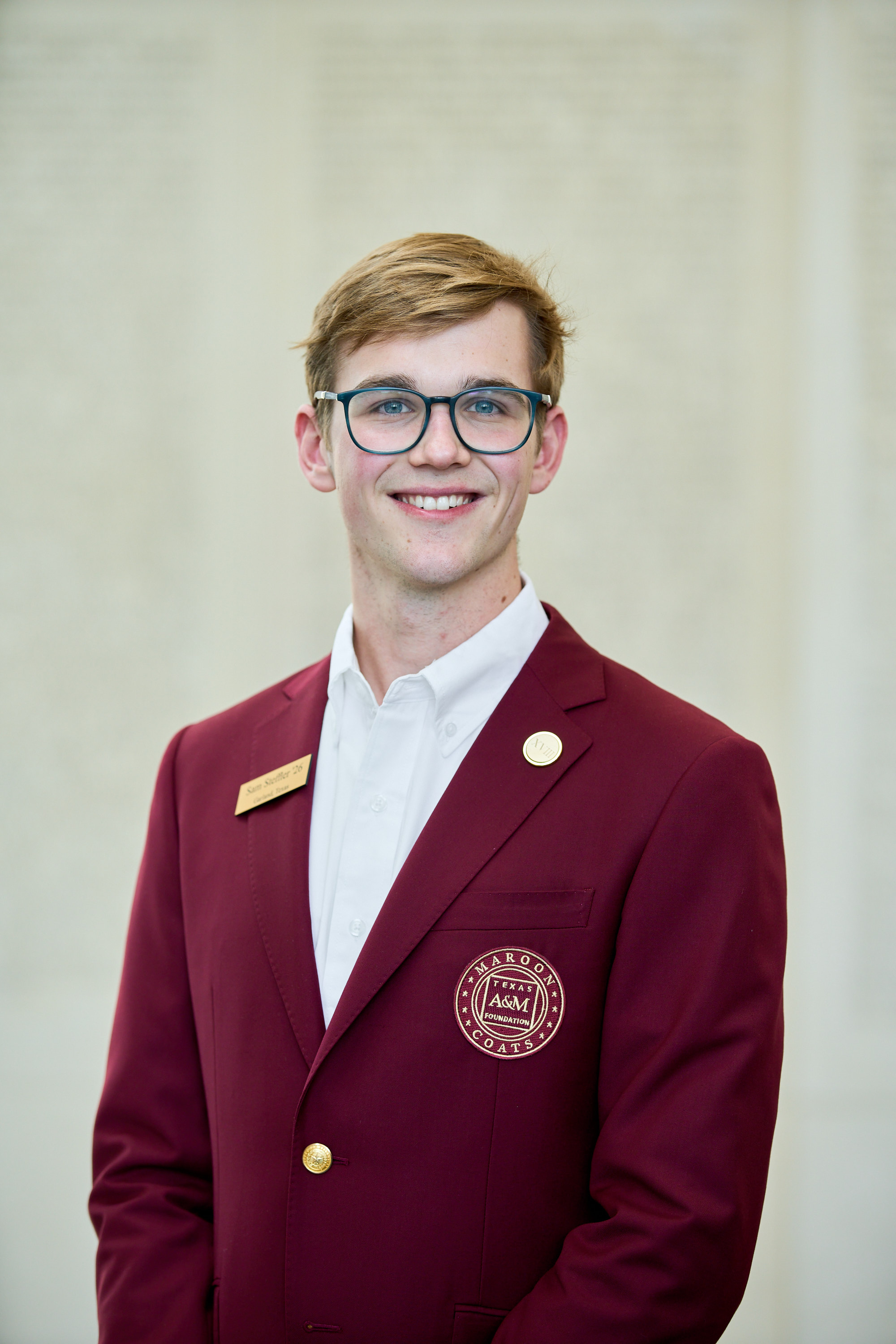 Maroon coat staff image