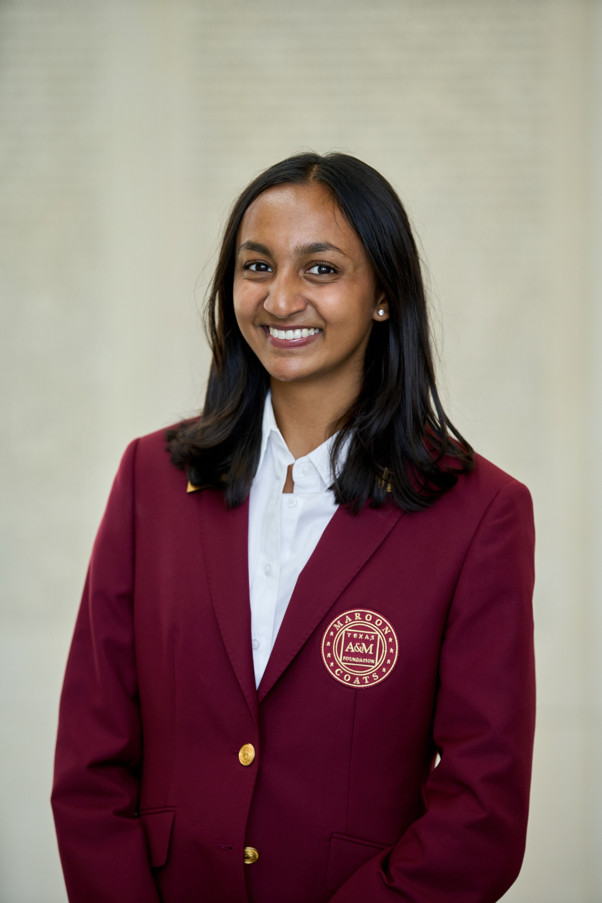 Maroon coat staff image